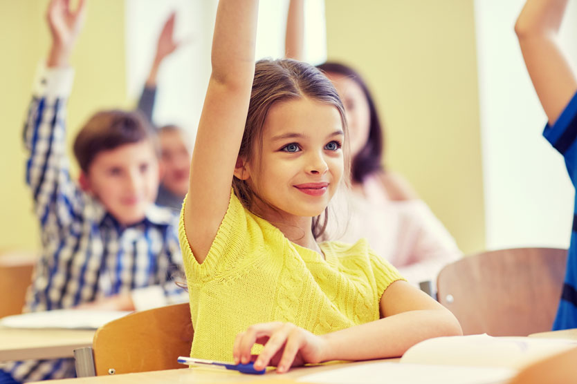 child raising hand